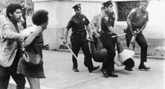 Police drag and carry New Haven Panther Edith Jackson, 18, off to courthouse after charging her with breach of peace and abusing a policeman during a rally supporting Panther defendant Lonnie McLucas Sunday, Aug. 30, 1970 in New Haven, Connecticut. (