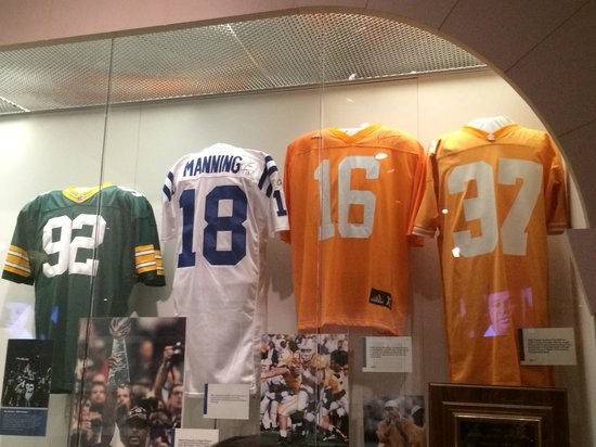 NFL jerseys on display within the Hall of Fame.