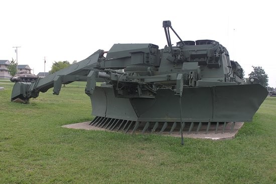 An engineering vehicle used for earthwork in combat environments