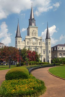 View of the facade of Saint Louis Cathedral from across Jackson Square. 