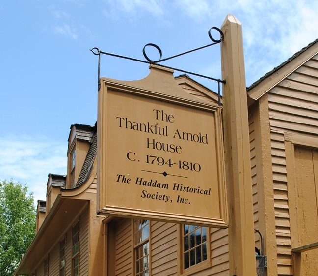 Sign indicating the house's name and its historical significance.