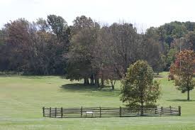 The fields across the street from the monument that are also part of the state park