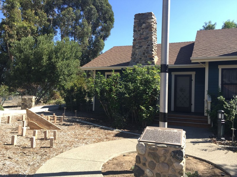 The rear of the home with historic marker.