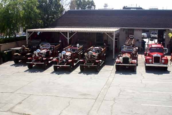 Vehicles on display in the museum's parking lot.