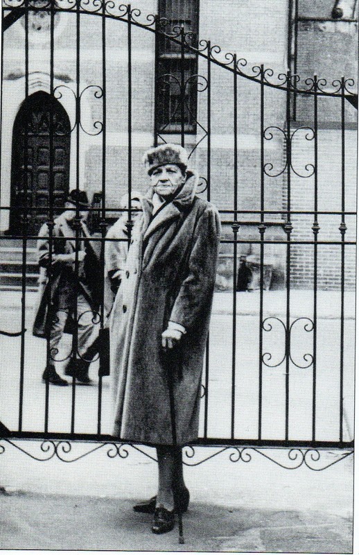 Djuna Barnes at the Patchin Place gate, photographed by Marion Morehouse in 1962 (image from Ephemeral New York)