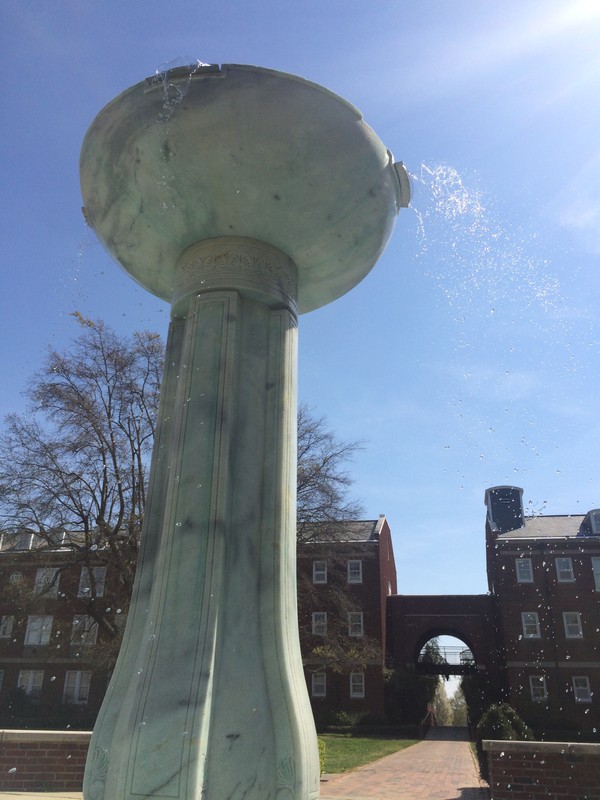 This fountain is located in the original quad on the campus between four dorms, the dining hall, and Johnston Hall.
