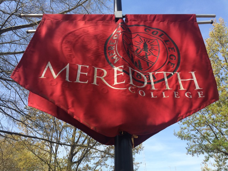 Displaying Meredith's colors and seal, these flags are located across the campus.