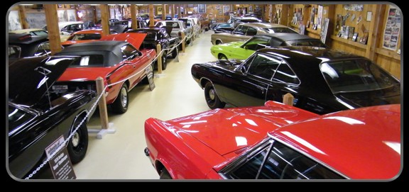 View of some the cars on display, many of which are muscle cars