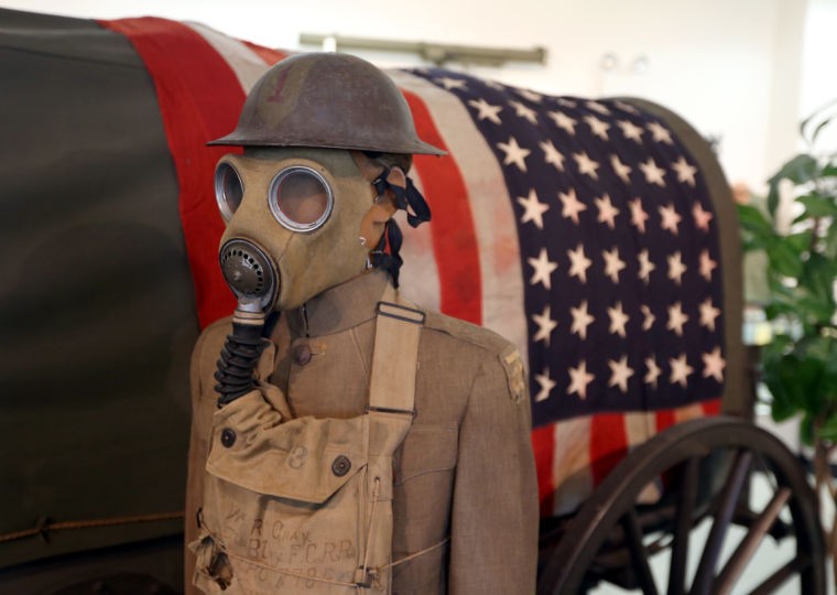 World War I gas mask and uniform on display.