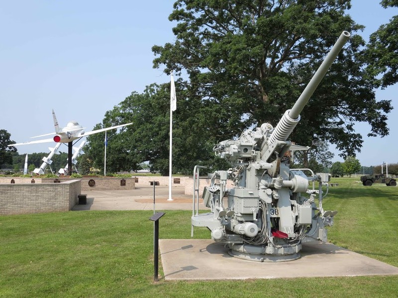 Artillery piece and aircraft located in the honor park.