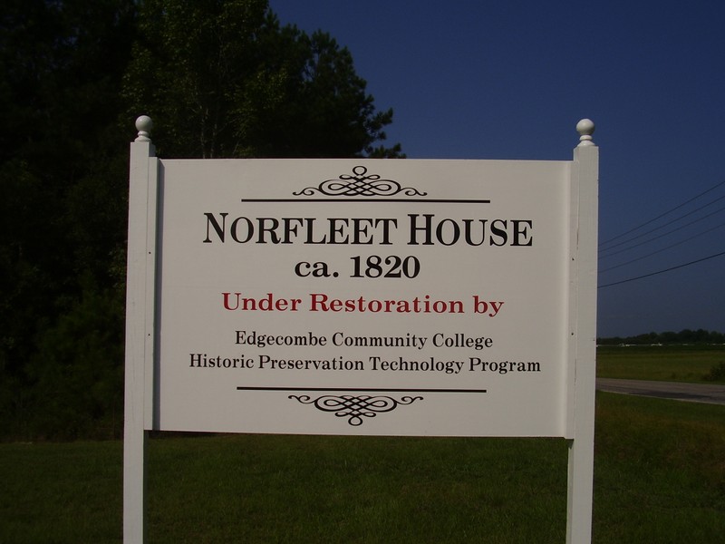 The sign out front on the highway identifies the house and the preservation program that is restoring the structure. 