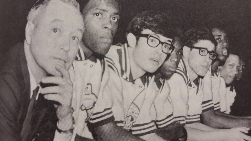 Dillard (second from the left) sits next to Marquiss in their first round match against North Platte in the state basketball tournament. (Omaha-World Herald)