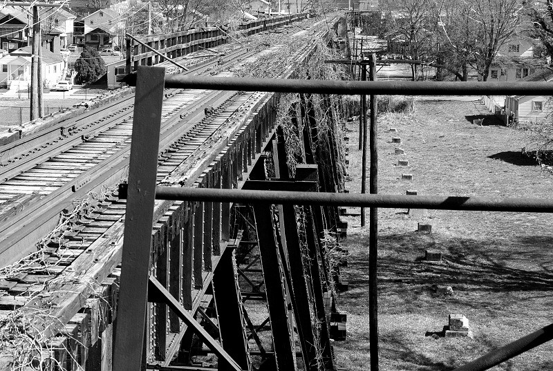 This photo shows the old concrete pylons that supported the single lane addition to the bridge that allowed for automobile traffic to cross Kanawha River. 