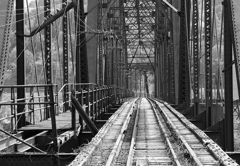 View of the bridge from end to end. Notice how narrow the bridge was and imagine a car lane on one side.