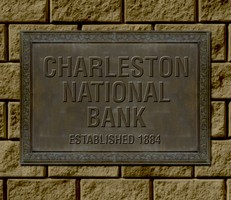 This plaque commemorates construction of the first Charleston National Bank in 1884.
