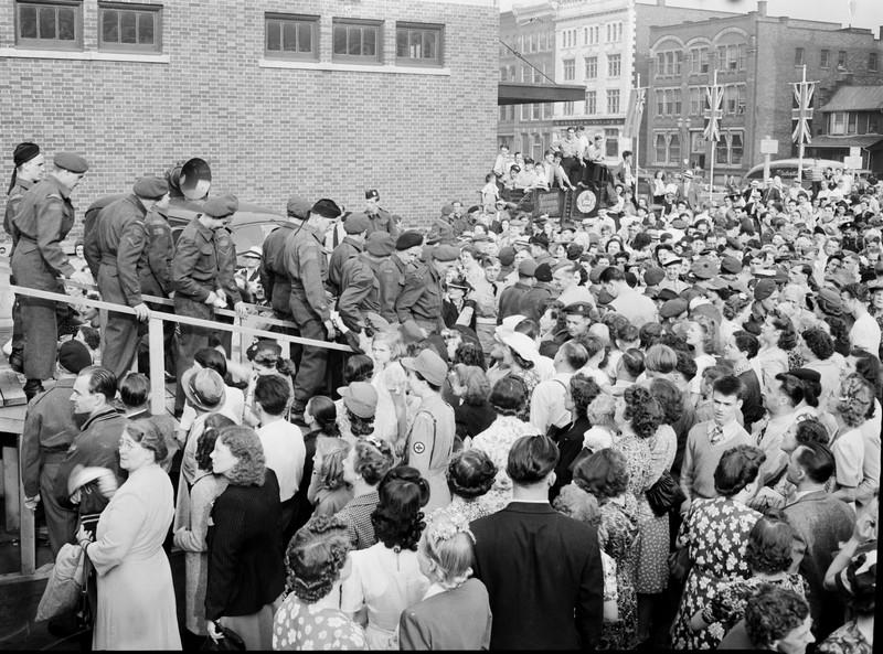Londoners greeting 300 arriving soldiers at the CNR Station on York Street, June 23, 1945.