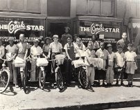 Local kids stand in front of The Omaha Star with stacks of newspapers. It was a major privilege to have your name printed in the paper during the Civil Rights Era because most of the media only portrayed Blacks in negative ways. 