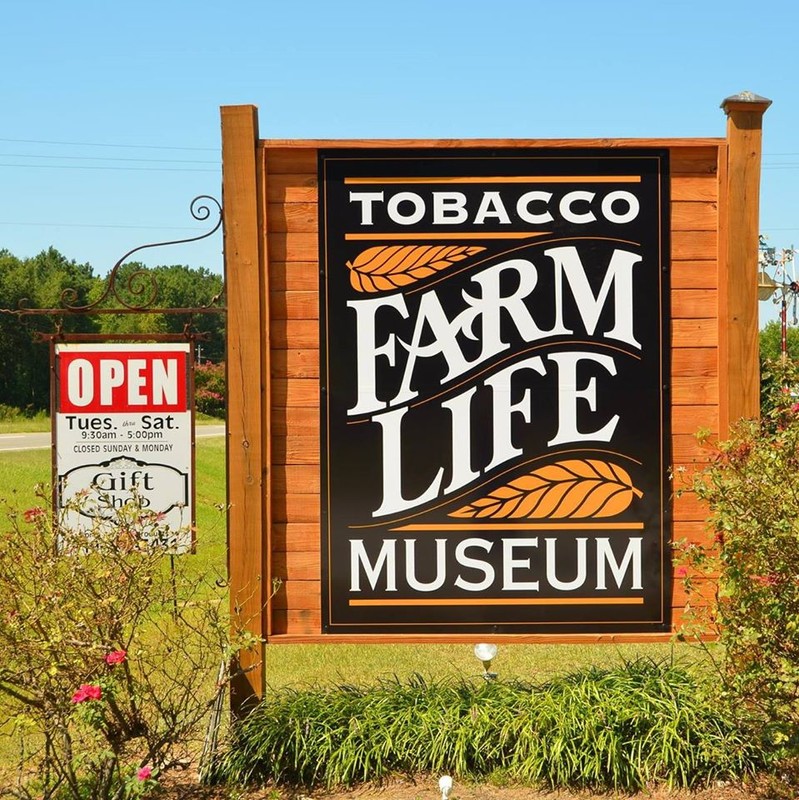 Tobacco Farm Life Museum sign located at the edge of the highway.