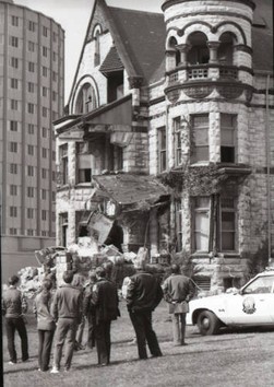 People look at the demolition of the Elizabeth Plankinton mansion circa October 1980