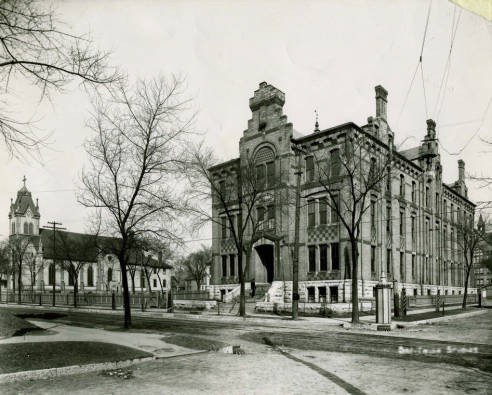 Marquette College with Holy Name Church circa 1900