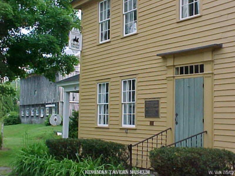 The Kingman Tavern Museum with barn in the background.