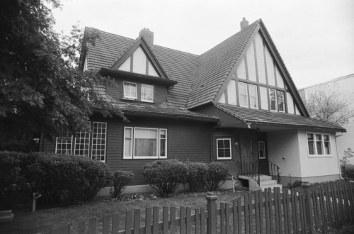 Black and white image of wood-frame house
