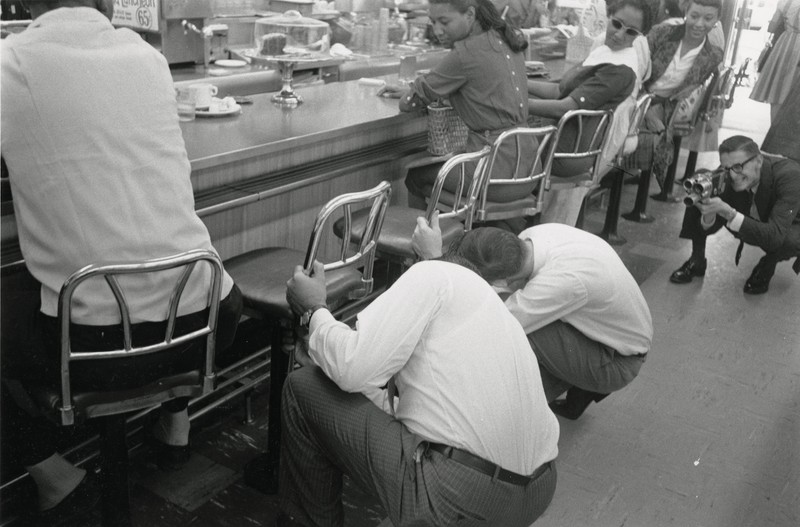 Staff remove stools during sit-in at White's Pharmacy.
AS-60-27281-09, Austin History Center, Austin Public Library