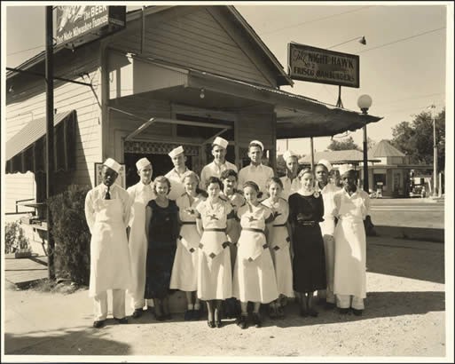 Night Hawk restaurant employees in front of the Night Hawk Number 2 at 1814 Guadalupe. 

PICA 28695, Austin History Center, Austin Public Library.