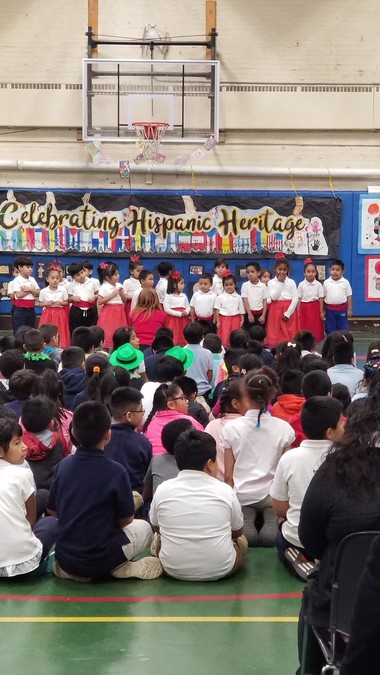 This is a photo of the student body and faculty inside their gymnasium during their annual Hispanic Heritage Celebration. Though it’s a little cramped for over 600 students, they find ways to make the best of it.