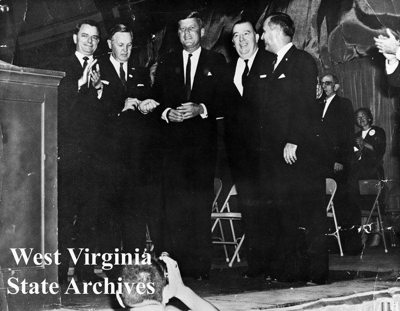 L-R: Senator Robert C. Byrd, state Democratic chairman Hulett C. Smith, Senator John F. Kennedy, Senator Jennings Randolph, Democratic gubernatorial candidate W.W. Barron. 1960. Civic Center Collection, West Virginia State Archives.