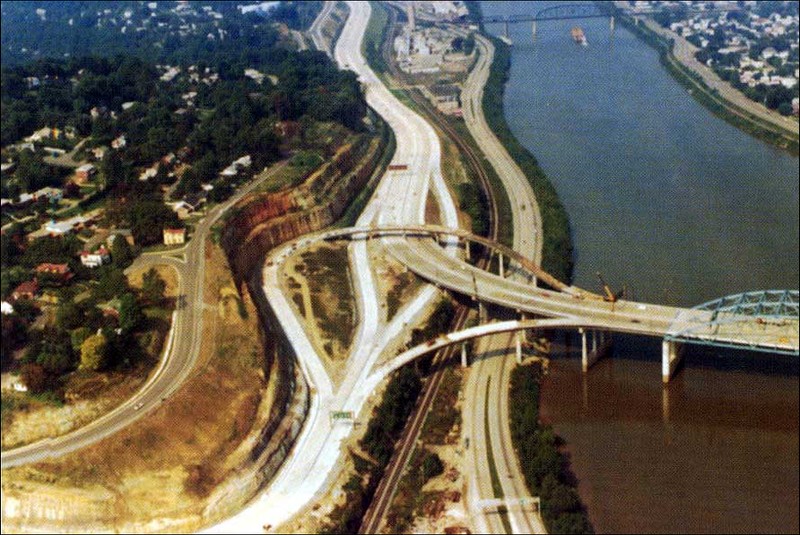 I-64 Bridge at U.S. Route 119 (Corridor G) Fort Hill interchange (Exit 58A) under construction in 1973. Image taken by Ray Lewis of the West Virginia Department of Transportation.

https://commons.wikimedia.org/wiki/File:3downtown.jpg 