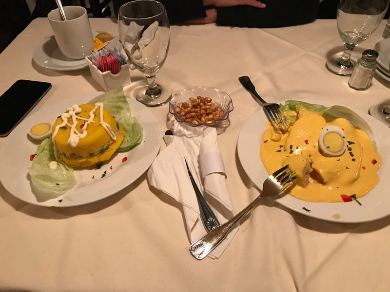 This is a picture taken by me when my family went out for my dad's birthday and this is a typical appetizer in a Peruvian Restaurant. On the left is Cause Rellena and on the right is an absolute fan favorite, Papa a la huancaina. They both are very different but taste absolutely amazing.