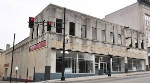 In the early 1930s, Danville architect J. Bryant Heard began to design in a somber monumental version of the Art Deco style. 501 Main Street--Woolworth's on corner #4--was designed by Mr. Heard in 1937 and built by R. E. Clarson. 