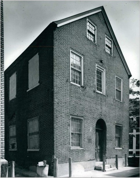 A black and white photo of the three-story brick building that housed Adelphi School.
