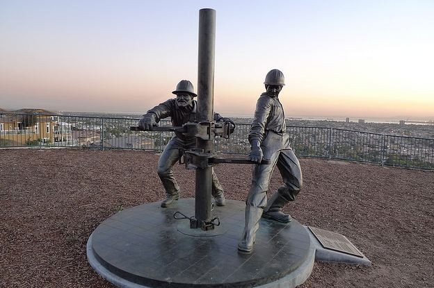 This photo shows a sculpture created by Cindy Jackson titled “Tribute to the Roughnecks” depicting two men bringing up petroleum following the 1921 oilfield discovery.