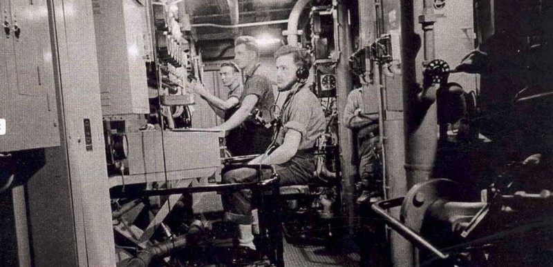 Men at work in the engine room