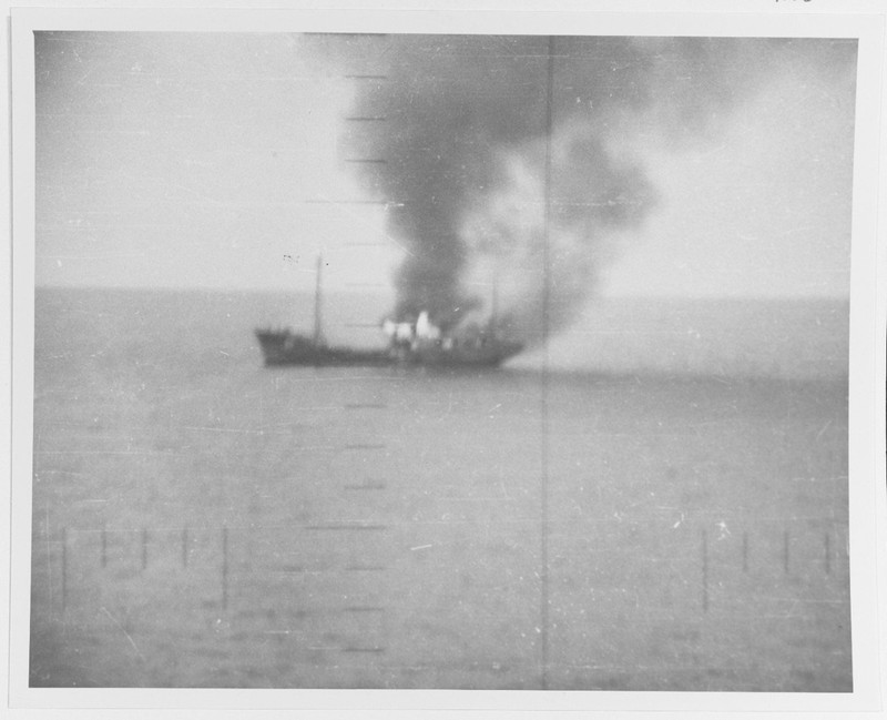 A Japanese picket vessel engulfed in flames after being attacked by the Silversides in October 1942. This photograph was taken through the sub's periscope. National Archives, RG80.