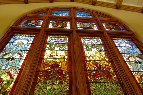 The stained glass windows in the main reading room, featuring Shakespeare, Goethe, Longfellow and Prescott