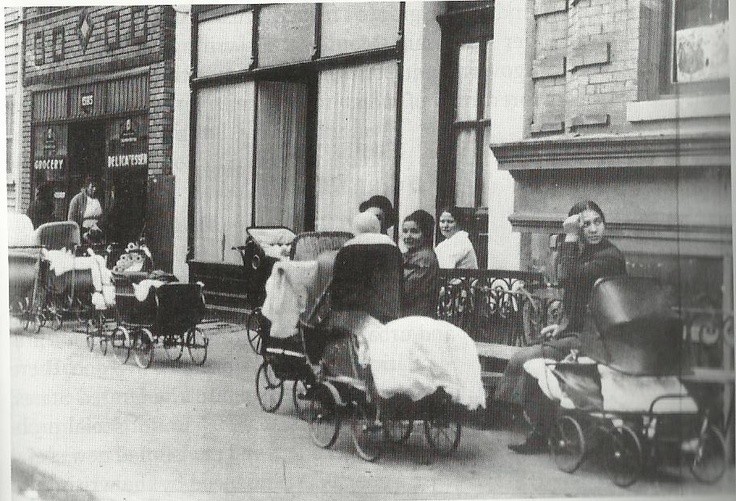 Mothers with carriages stand outside the Brownsville Clinic, Brooklyn