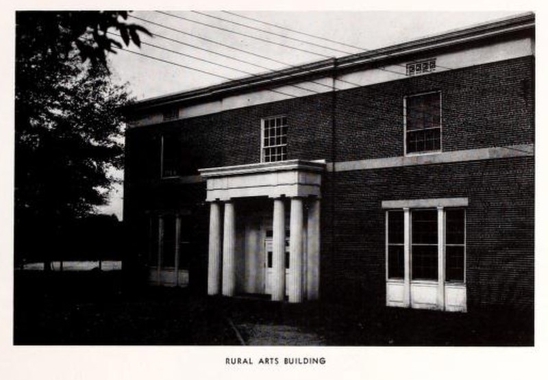 Photo in black and white of brick building 