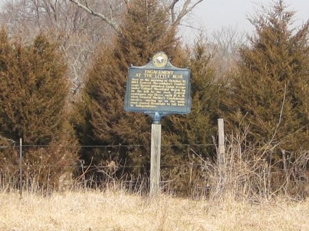 This marker is on the westbound side of the highway on the east side of the Little Blue River