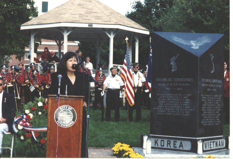 Mrs. Sam Yoon reading a poem to honor her brother, at Vietnam War memorial dedication