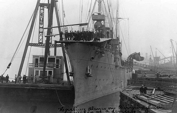 Ely's Curtiss biplane being hoisted aboard the USS Birmingham.