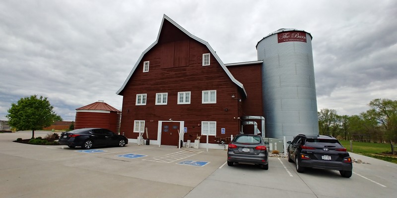 Main entrance to the barn. An elevator was added during renovations. The silo is an aesthetic addition to cover the elevator. Photo taken May 6, 2020.