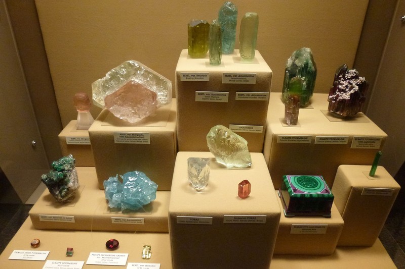 Many minerals, gems, and other rock specimens are on display.