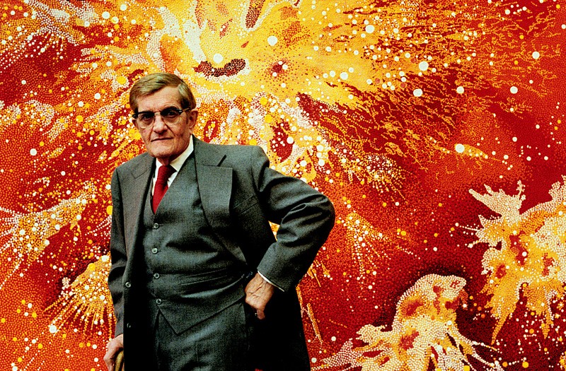 Vance Kirkland with his 1978 painting, Explosions of Energy Near the Sun Fifty Billion Years B.C. (image from the Kirkland Museum)