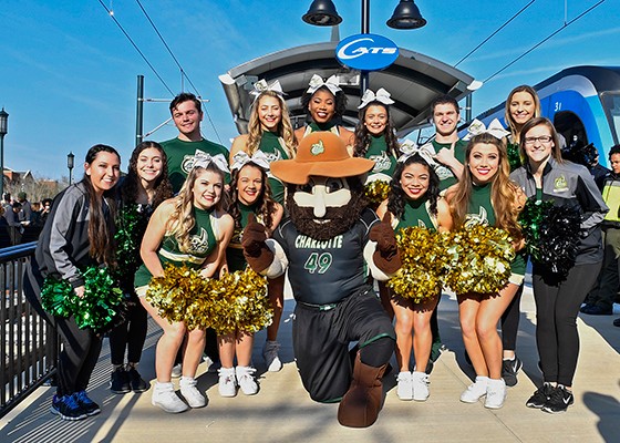 UNC Charlotte cheerleaders and mascot Norm the Miner celebrate the opening of the LYNX Blue Line Extension on March 16, 2018. The Lynx Blue Line connects UNC Charlotte's main campus to the Dubois Center at UNC Charlotte Center City, and beyond to I 485 on the outskirts of Pineville, North Carolina.