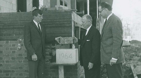 The cornerstone is laid during the construction of the library, 1964