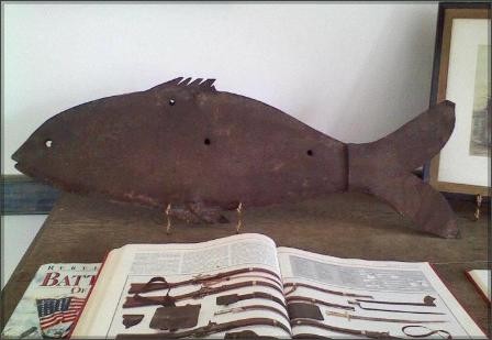 This original fish weathervane that is believed to have been shot by the notorious Jesse James Gang in 1868.