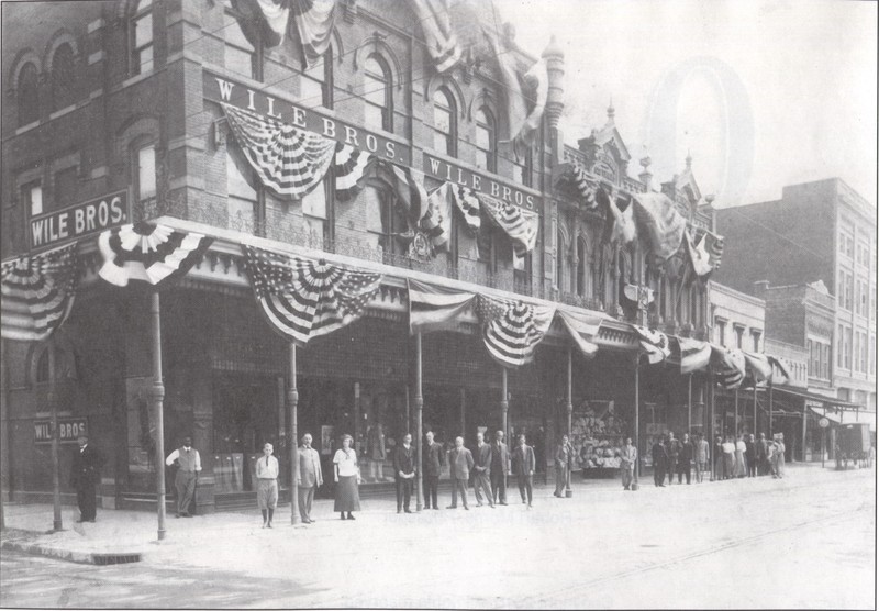 Employees in front of Wile Clothier Co, ca. 1912